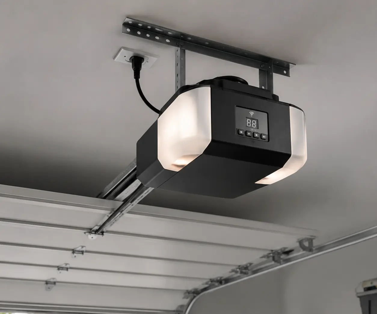 Technician installing a modern garage door opener